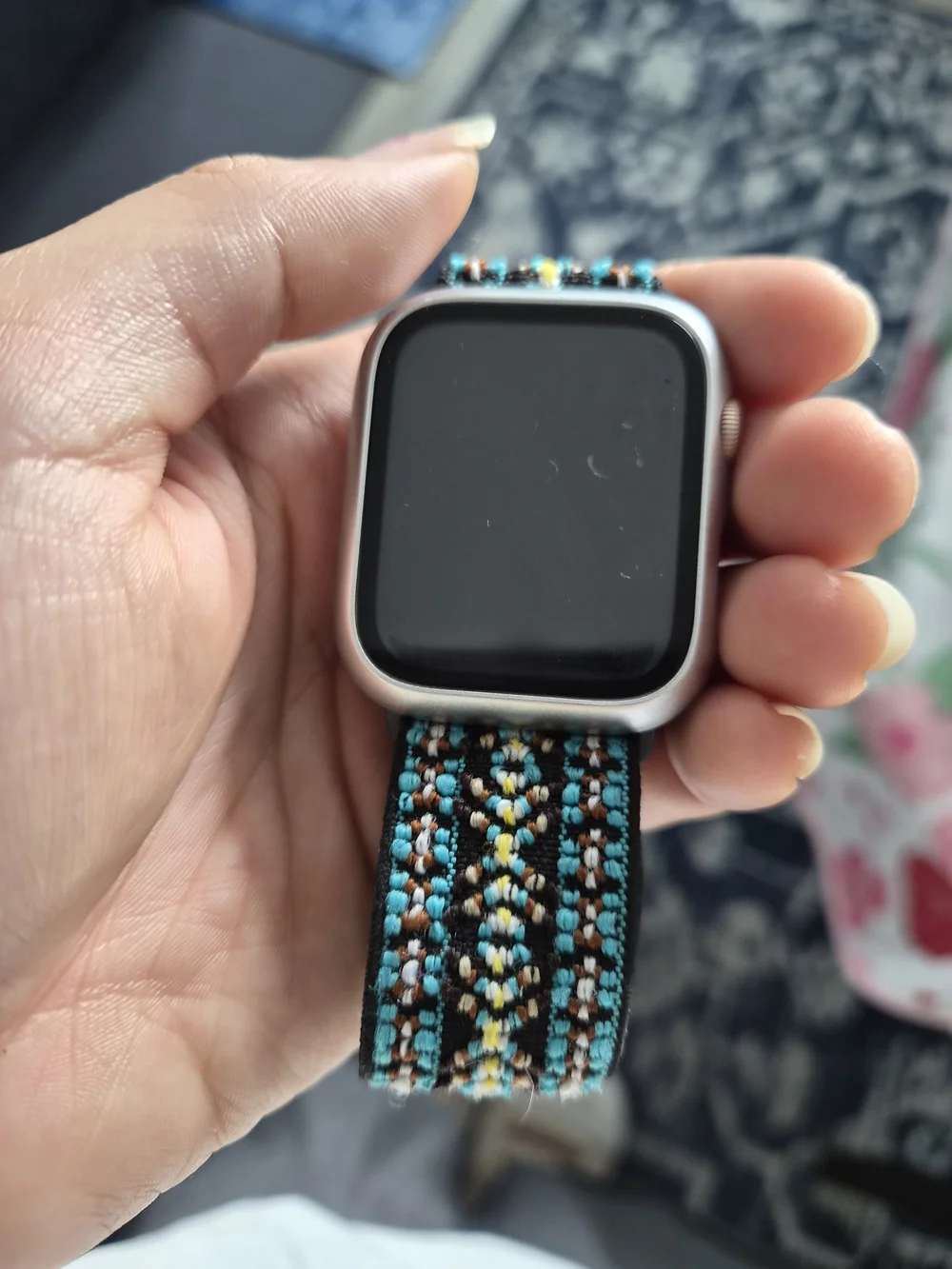 Apple Smartwatch with Black Case and Teal Patterned Woven Band